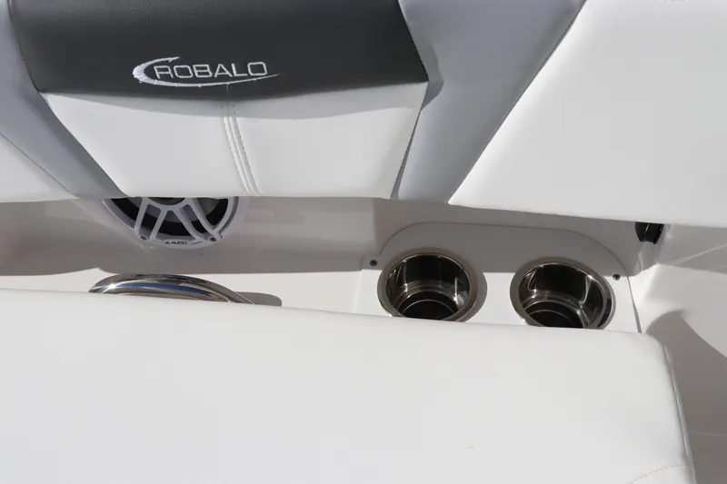 Slide: The Image of 2024 Robalo 266 Cayman boat interior with cup holders and speaker. - 48