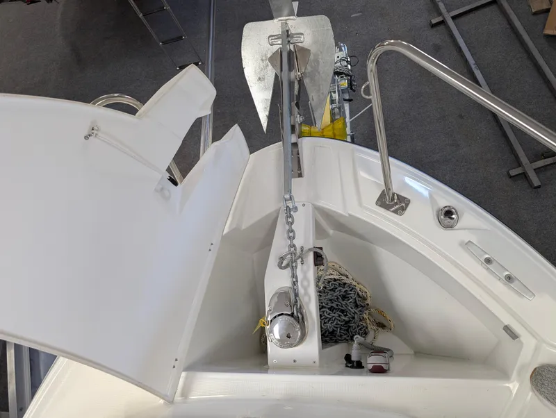 Slide: The Image of 2024 Jeanneau NC 695 Series 2 boat anchor system with chain and storage compartment. - 15