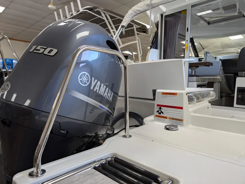 Slide: The Image of 2024 Jeanneau NC 695 Series 2 with Yamaha 150 outboard motor, interior view. - 2