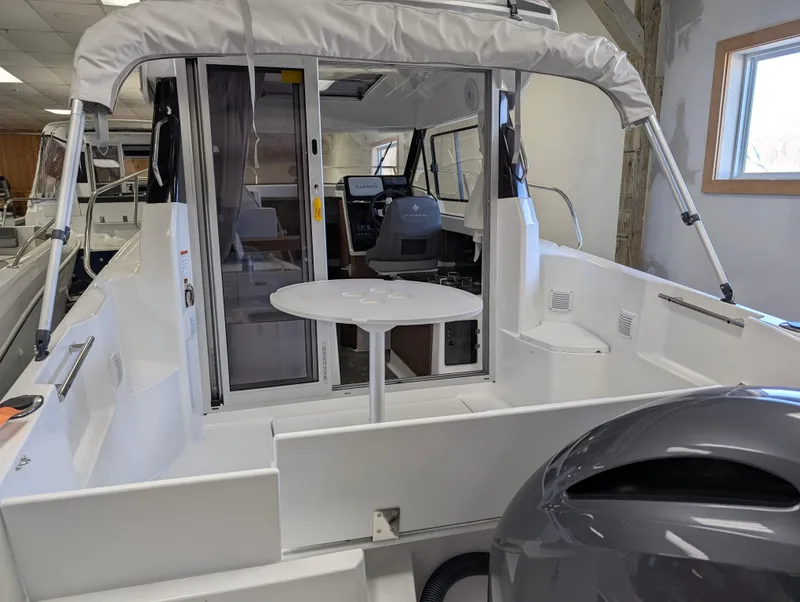 Slide: The Image of 2024 Jeanneau NC 695 Series 2 boat interior with seating and table. - 3