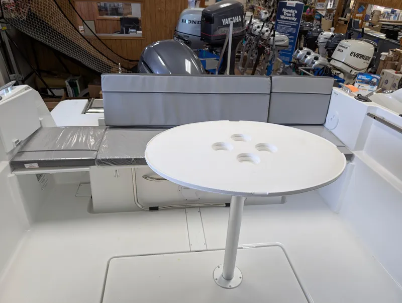 Slide: The Image of 2024 Jeanneau NC 695 Series 2 boat interior with seating and table. - 4