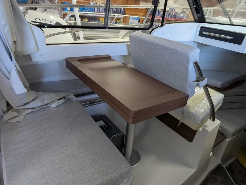 Slide: The Image of Interior of 2024 Jeanneau NC 695 Series 2 boat with seating and table. - 8