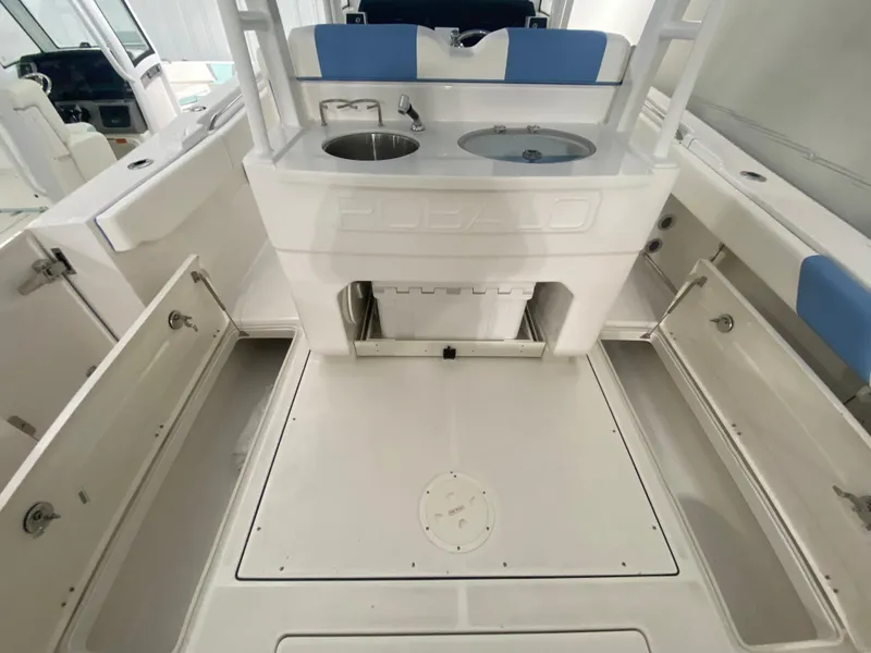Slide: The Image of 2024 Robalo R302 boat interior with storage compartments and seating. - 38