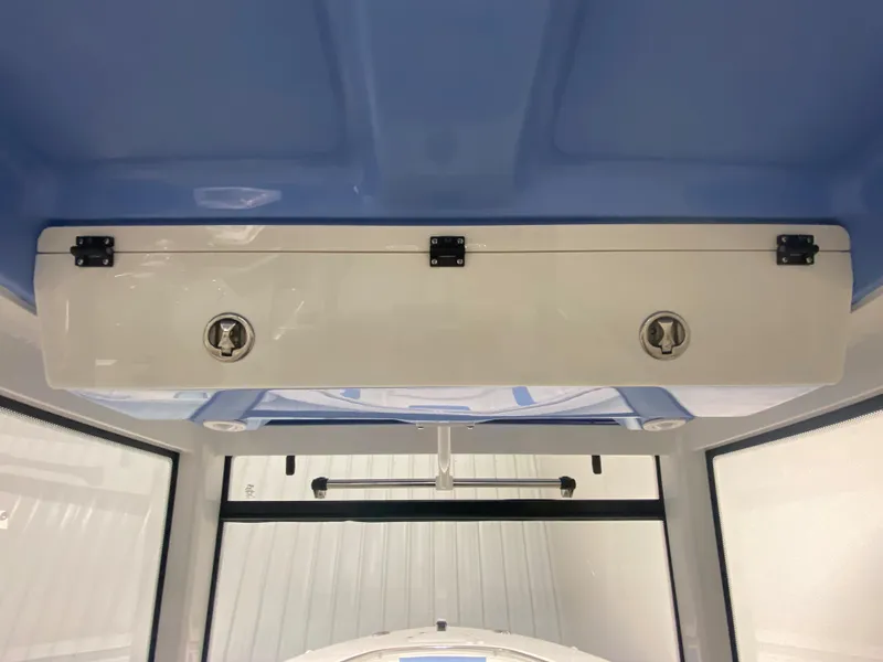 Slide: The Image of 2024 Robalo R302 boat interior storage compartment. - 25