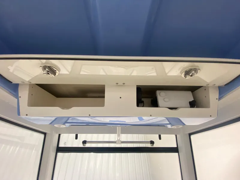 Slide: The Image of Overhead storage compartment in 2024 Robalo R302 boat. - 28