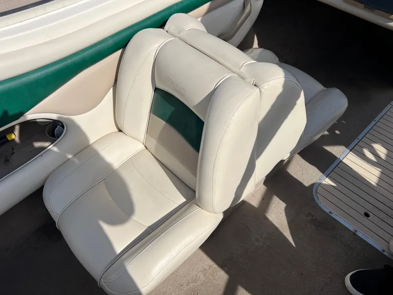 Slide: The Image of 2002 Stingray 180 LS/LX boat interior seat, white and green upholstery. - 17