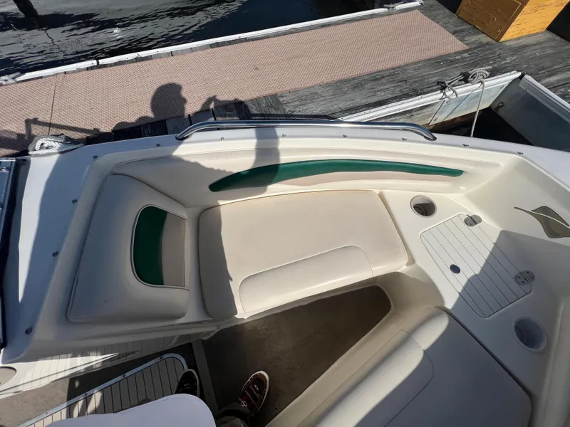 Slide: The Image of 2002 Stingray 180 LS/LX boat interior with white and green seating. - 19