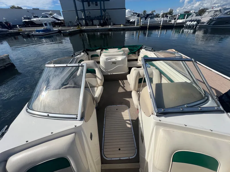 Slide: The Image of 2002 Stingray 180 LS/LX boat interior at marina with seating and windshield. - 21