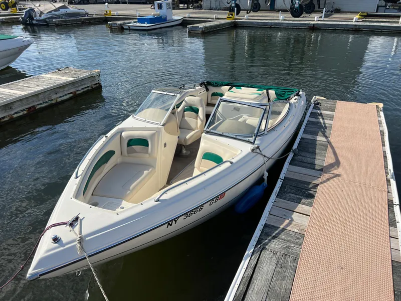 Slide: The Image of 2002 Stingray 180 LS/LX boat docked at a marina. - 22