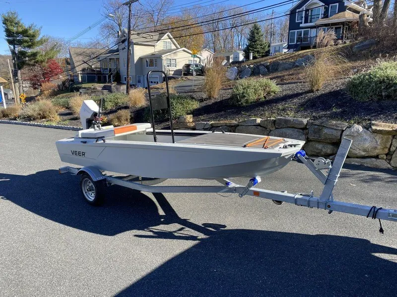 Slide: The Image of 2024 Veer V13 boat on trailer, parked on residential street. - 4