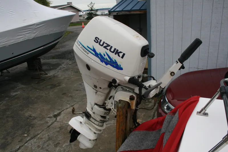 Slide: The Image of Suzuki outboard motor on a 1991 Olympic 23' Runabout boat. - 21