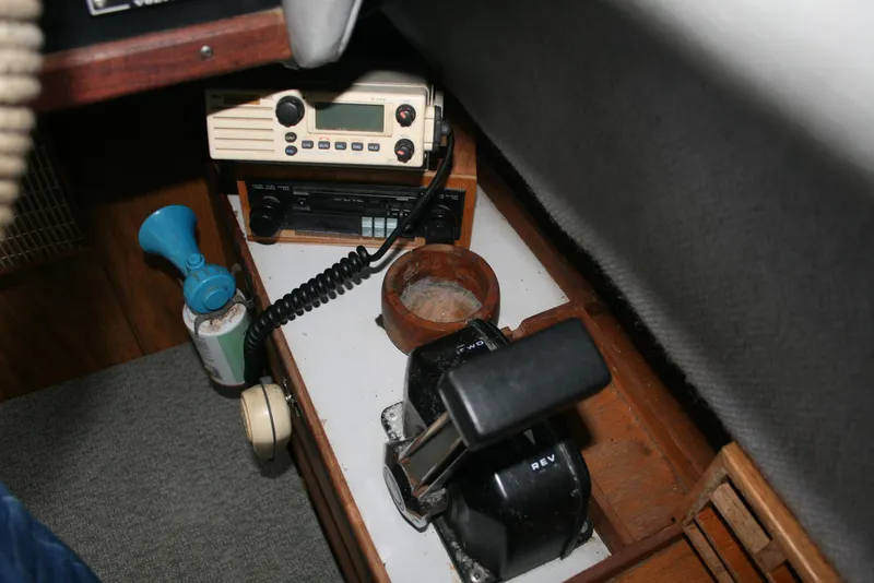 Slide: The Image of Control panel of a 1991 Olympic 23' Runabout boat with radio and throttle. - 7