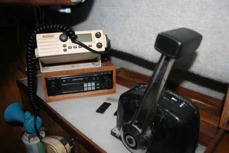 Slide: The Image of Boat control panel with radio and throttle in a 1991 Olympic 23' Runabout. - 8