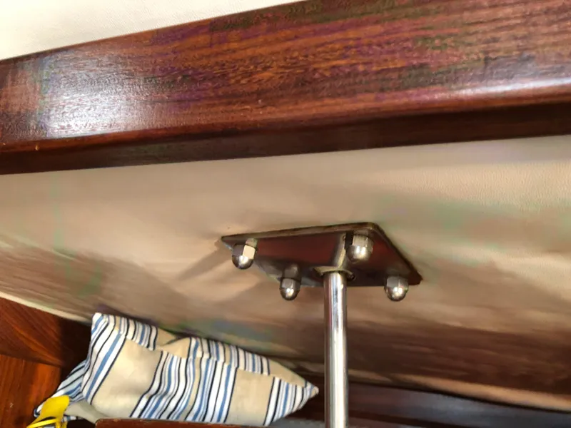 Slide: The Image of Interior detail of 1985 Beneteau First 345 sailboat, featuring wooden trim and metal fittings. - 16