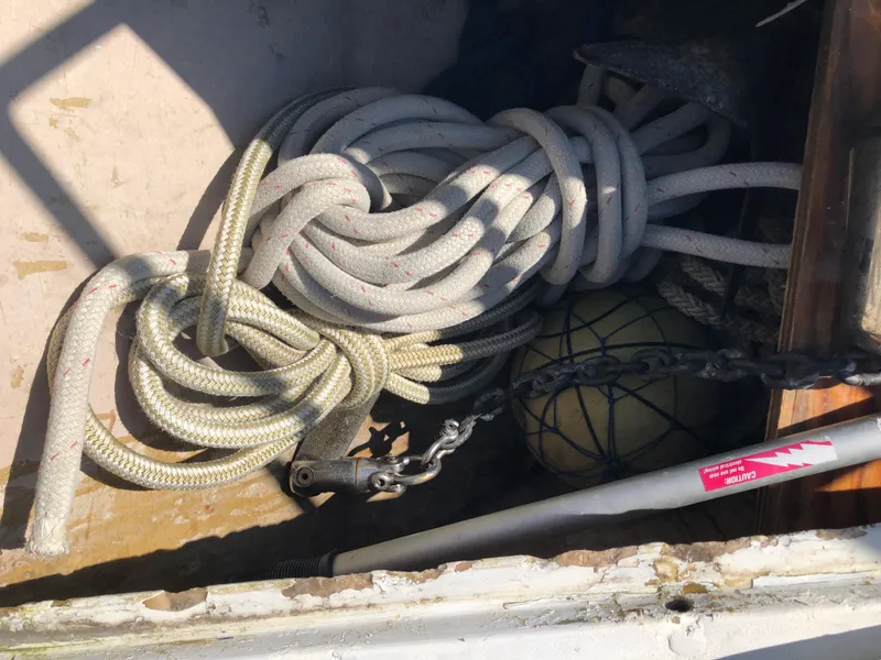 Slide: The Image of Coiled ropes and equipment in a Beneteau First 345 sailboat, 1985 model. - 19
