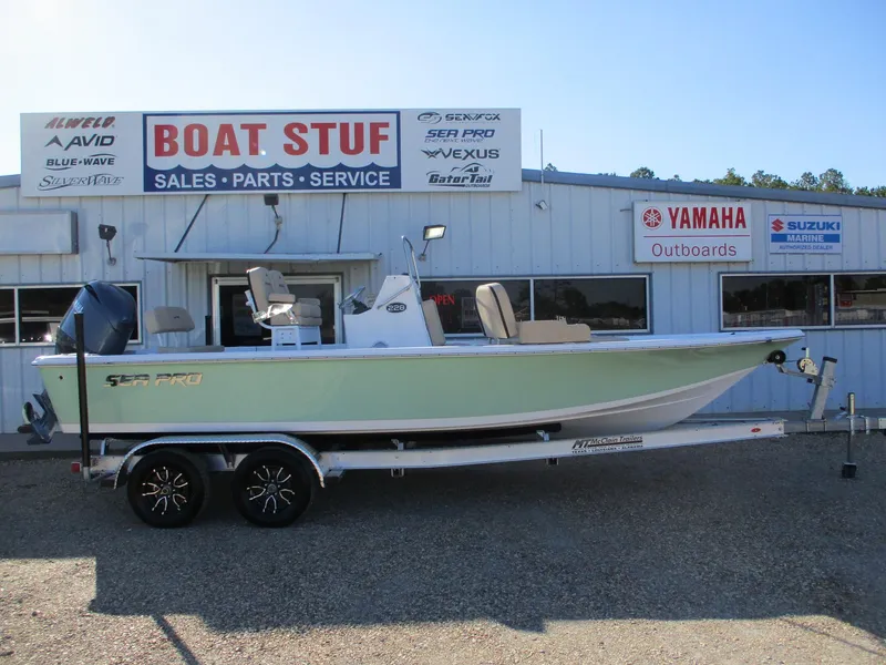 Slide: The Image of 2024 Sea Pro 228 DLX Bay boat on trailer at dealership, Boat Stuf, for sale. - 0