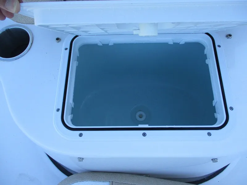 Slide: The Image of Open storage compartment on 2024 Sea Pro 228 DLX Bay boat. - 18