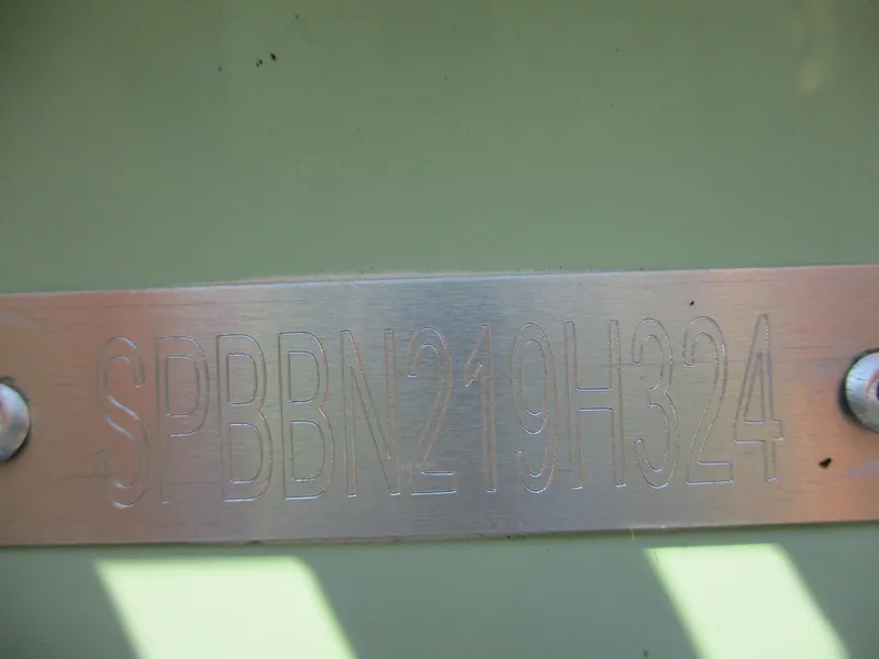 Slide: The Image of 2024 Sea Pro 228 DLX Bay boat hull identification number (HIN) plate. - 21