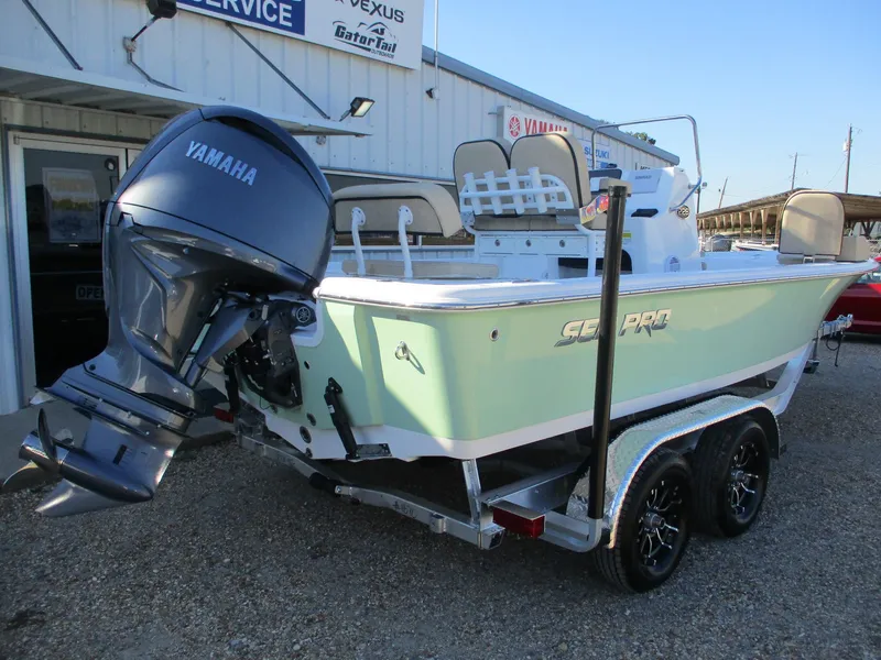 Slide: The Image of 2024 Sea Pro 228 DLX Bay boat with Yamaha outboard motor on trailer. - 4