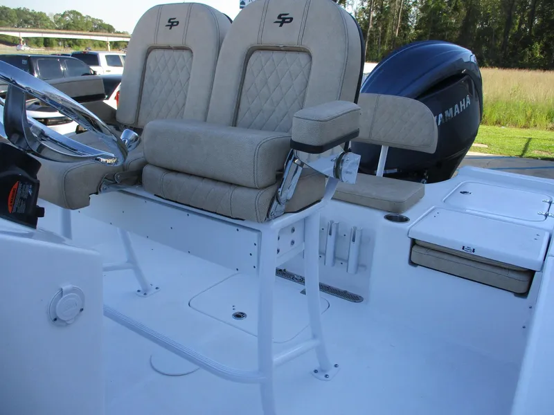 Slide: The Image of 2024 Sea Pro 228 DLX Bay boat with beige seating and Yamaha outboard motor. - 5