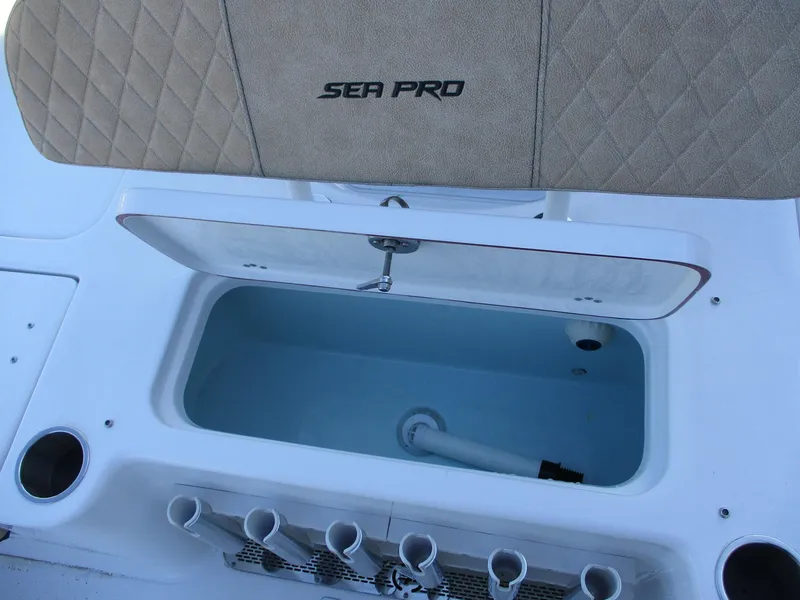 Slide: The Image of 2024 Sea Pro 228 DLX Bay boat livewell and rod holders. - 8