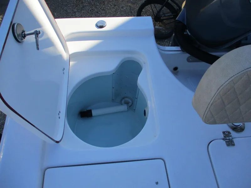 Slide: The Image of 2024 Sea Pro 228 DLX Bay boat livewell with open lid. - 9