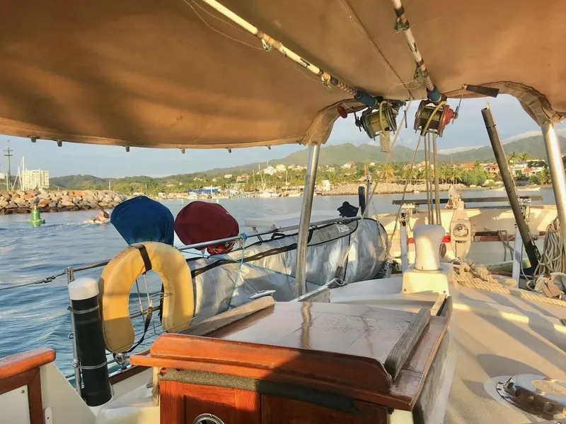 Slide: The Image of Salar 40 sailboat from 1975 docked in a scenic marina setting. - 21