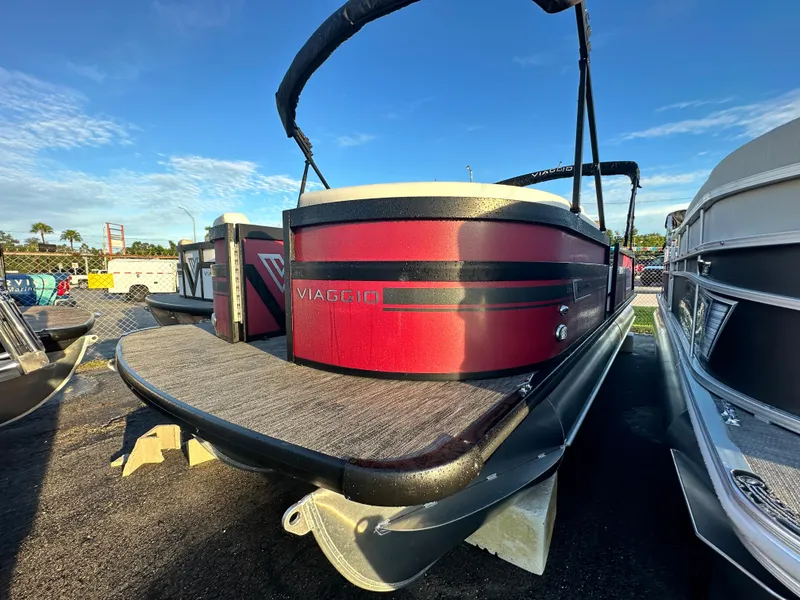 The Image of 2023 Viaggio Diamante S pontoon boat in red, docked outdoors. - 0