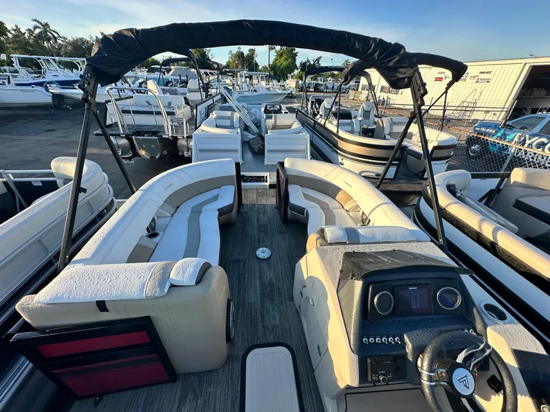 Slide: The Image of 2023 Viaggio Diamante S pontoon boat with spacious seating and modern dashboard. - 10