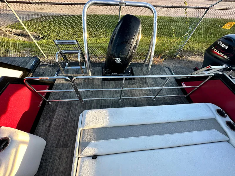 Slide: The Image of 2023 Viaggio Diamante S boat deck with motor and seating area. - 8