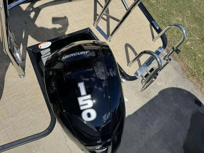 Slide: The Image of 2024 Harris Cruiser 210 with Mercury 150 outboard motor. - 7