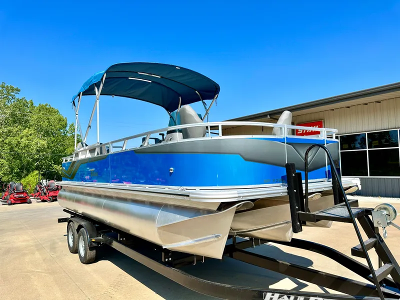 Slide: The Image of 2023 Tahoe Pontoon 23FT Sport 85 Center Console Fish boat on trailer. - 1
