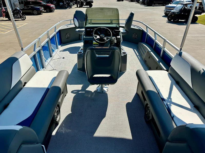 Slide: The Image of 2023 Tahoe Pontoon 23FT Sport 85 Center Console Fish boat interior with seating and steering console. - 10