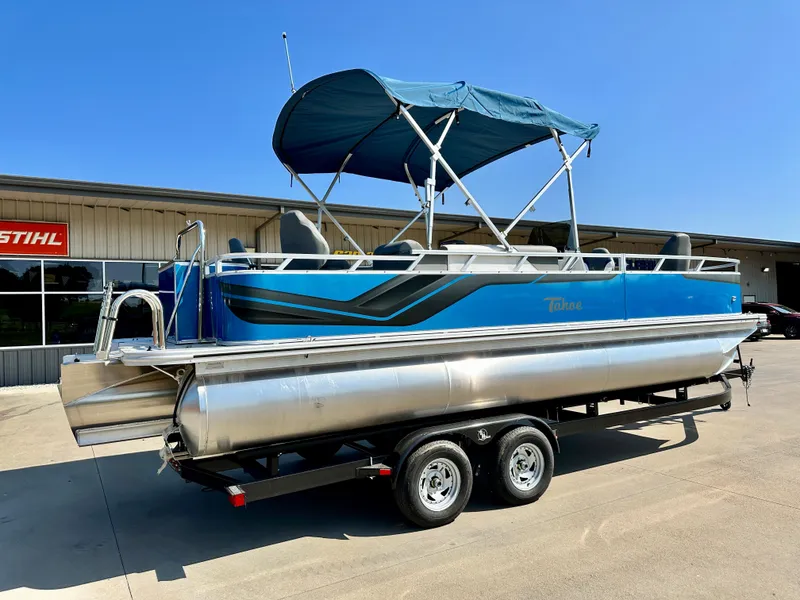 Slide: The Image of 2023 Tahoe Pontoon 23FT Sport 85 Center Console Fish boat with blue canopy. - 2