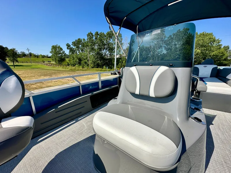 Slide: The Image of 2023 Tahoe Pontoon 23FT Sport 85 Center Console Fish boat interior with seating and console. - 4