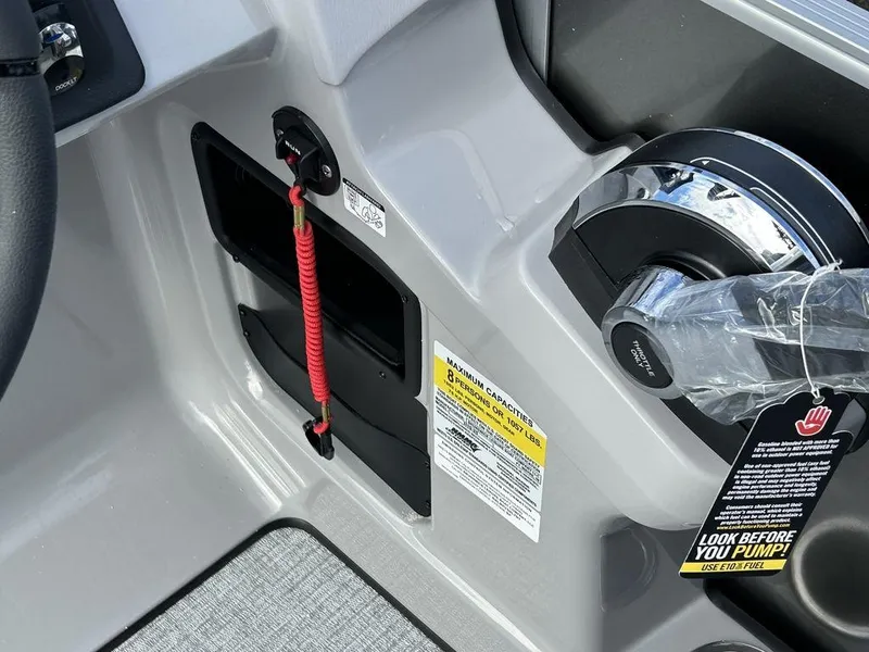 Slide: The Image of 2024 Harris Cruiser 190 boat control panel with safety lanyard and throttle. - 10