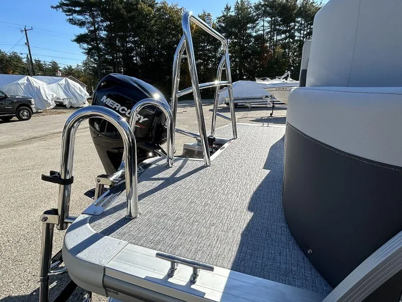 Slide: The Image of 2024 Harris Cruiser 190 boat with Mercury outboard motor and stainless steel ladder. - 7