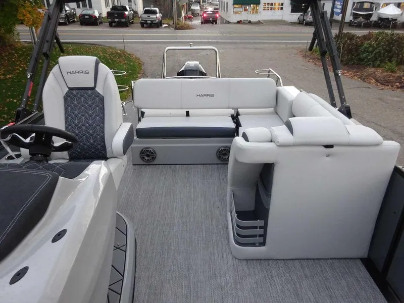 Slide: The Image of 2024 Harris Grand Mariner 230 interior with plush seating and modern design. - 11