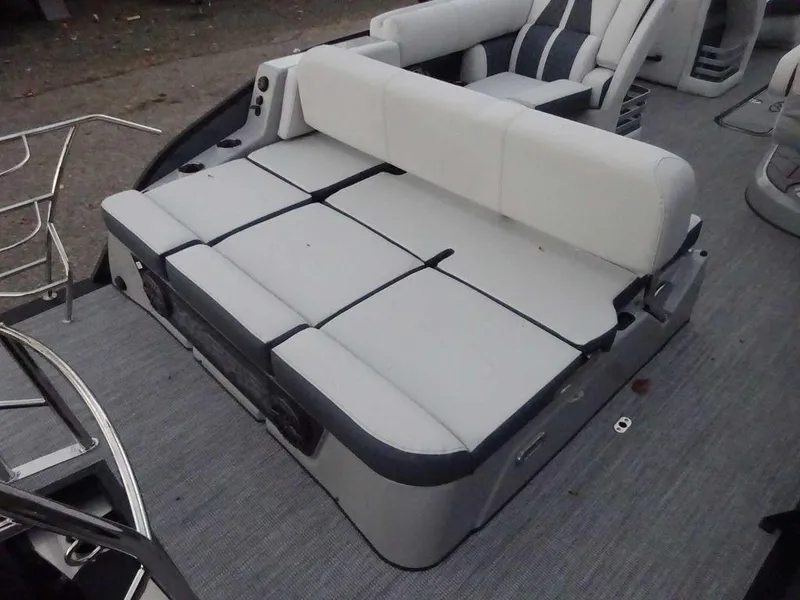 Slide: The Image of 2024 Harris Grand Mariner 230 boat interior with gray seating and adjustable backrest. - 12