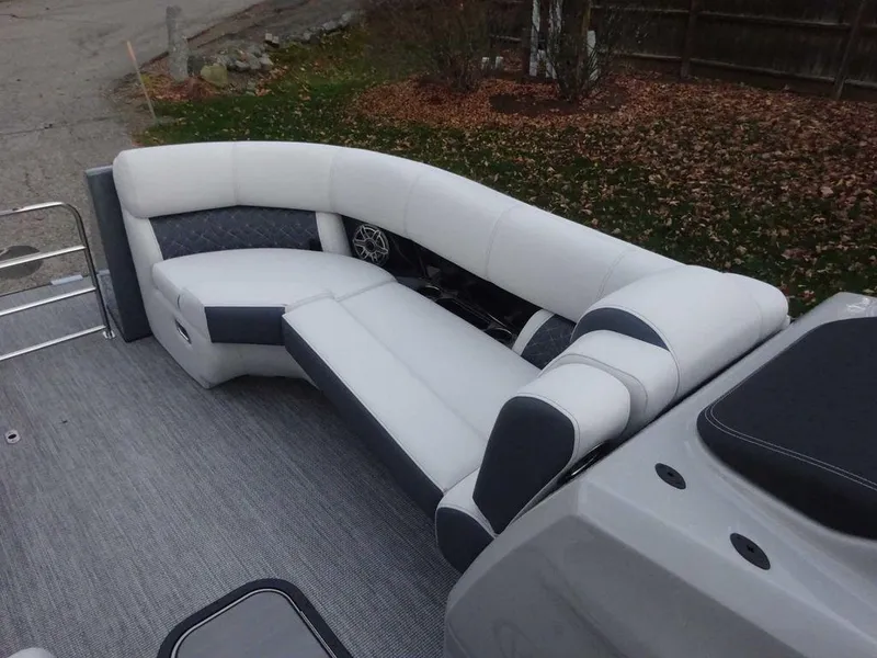 Slide: The Image of 2024 Harris Grand Mariner 230 boat interior with white and gray seating. - 9