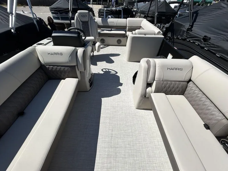 Slide: The Image of 2024 Harris Sunliner 230 pontoon boat interior with luxurious seating and modern design. - 15