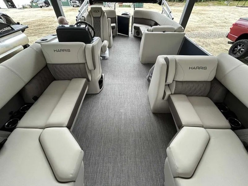 Slide: The Image of 2024 Harris Sunliner 210 boat interior with spacious seating and modern design. - 8