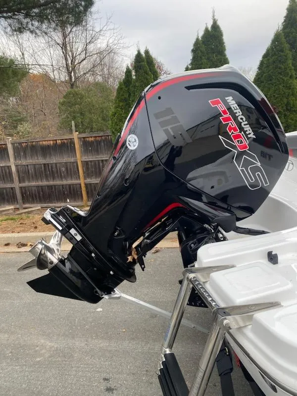 Slide: The Image of 2024 Tahoe T18 boat with a Mercury Pro XS outboard motor. - 4