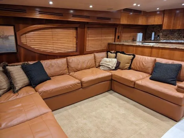 Slide: The Image of Luxurious interior of a 2007 Hatteras 68 Convertible yacht with leather seating. - 4