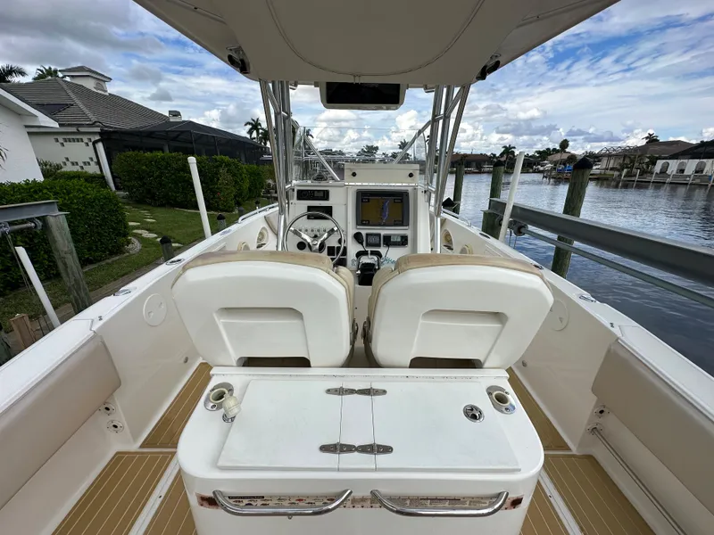 Slide: The Image of 2014 Stamas 317 Tarpon boat interior with dual seats and control panel. - 12