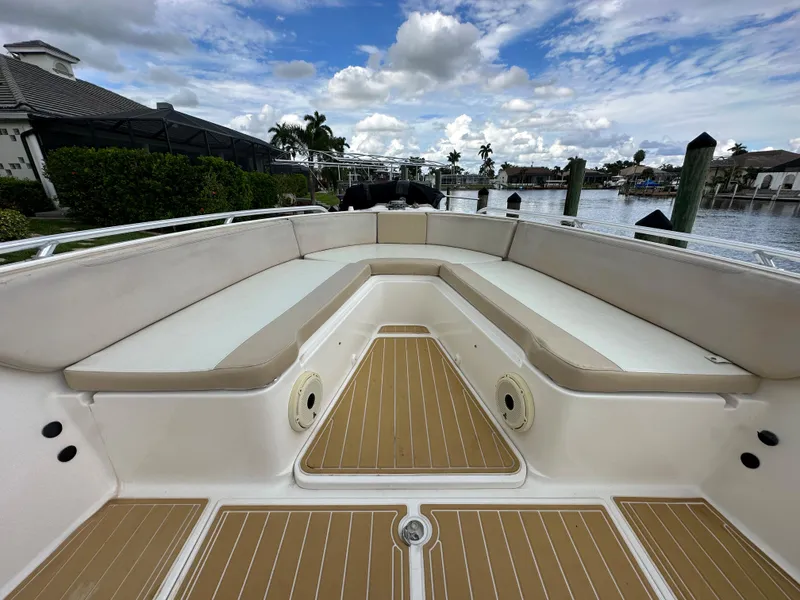 Slide: The Image of 2014 Stamas 317 Tarpon boat with spacious seating and scenic waterfront view. - 17
