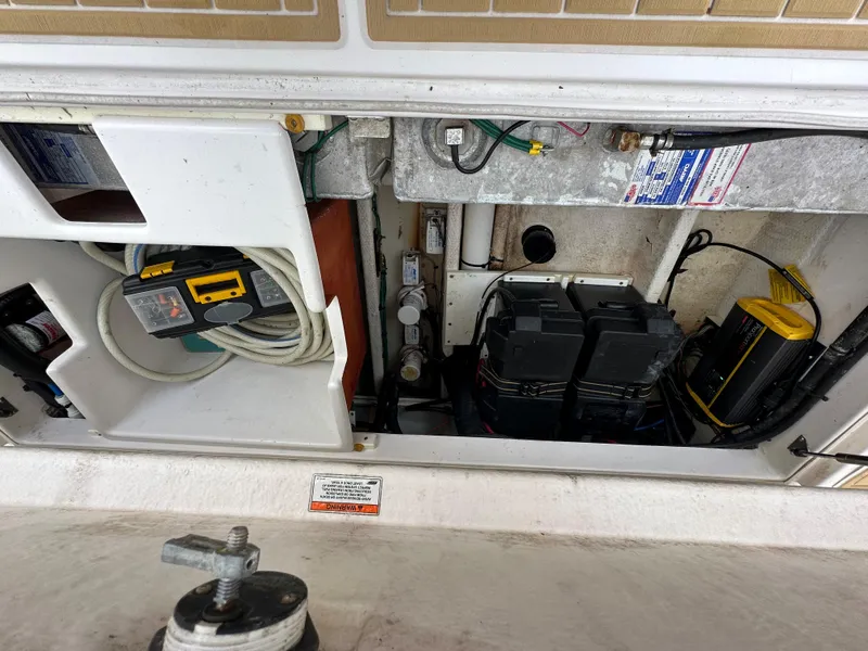 Slide: The Image of 2014 Stamas 317 Tarpon boat battery compartment and electrical wiring. - 22