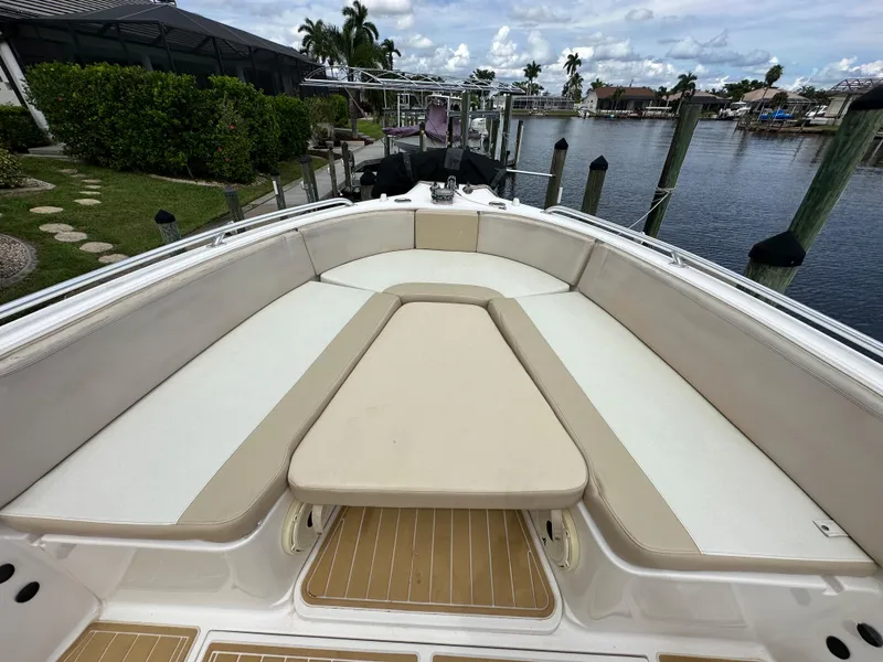 Slide: The Image of 2014 Stamas 317 Tarpon boat with spacious bow seating at a dock. - 6