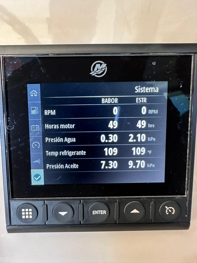 Slide: The Image of Display screen on 2023 Boston Whaler 325 Conquest showing engine metrics and system status. - 12