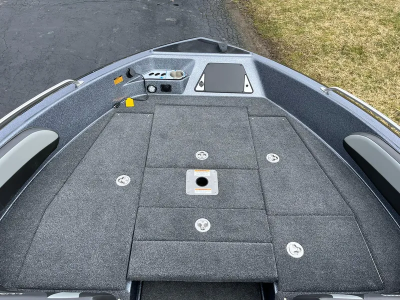 Slide: The Image of 2024 Lund 189 Tyee GL boat deck with storage compartments and seating. - 10